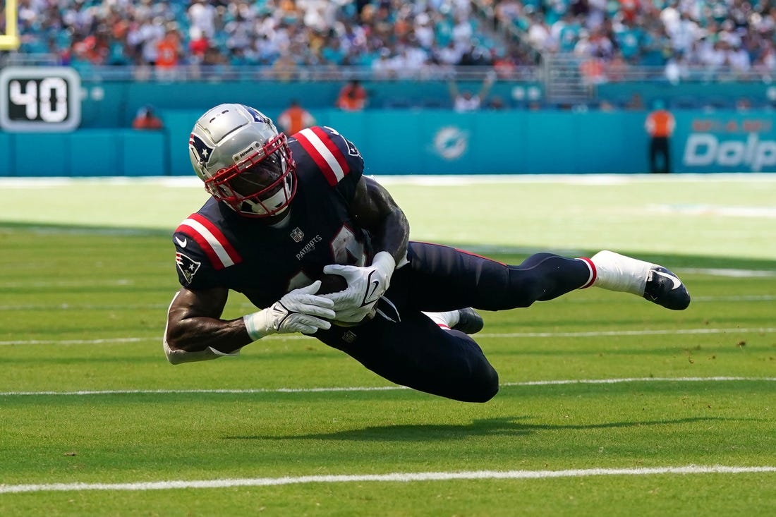 Sep 11, 2022; Miami Gardens, Florida, USA; New England Patriots wide receiver Ty Montgomery (14) slips after catching a pass during the second half against the Miami Dolphins at Hard Rock Stadium. Mandatory Credit: Jasen Vinlove-USA TODAY Sports