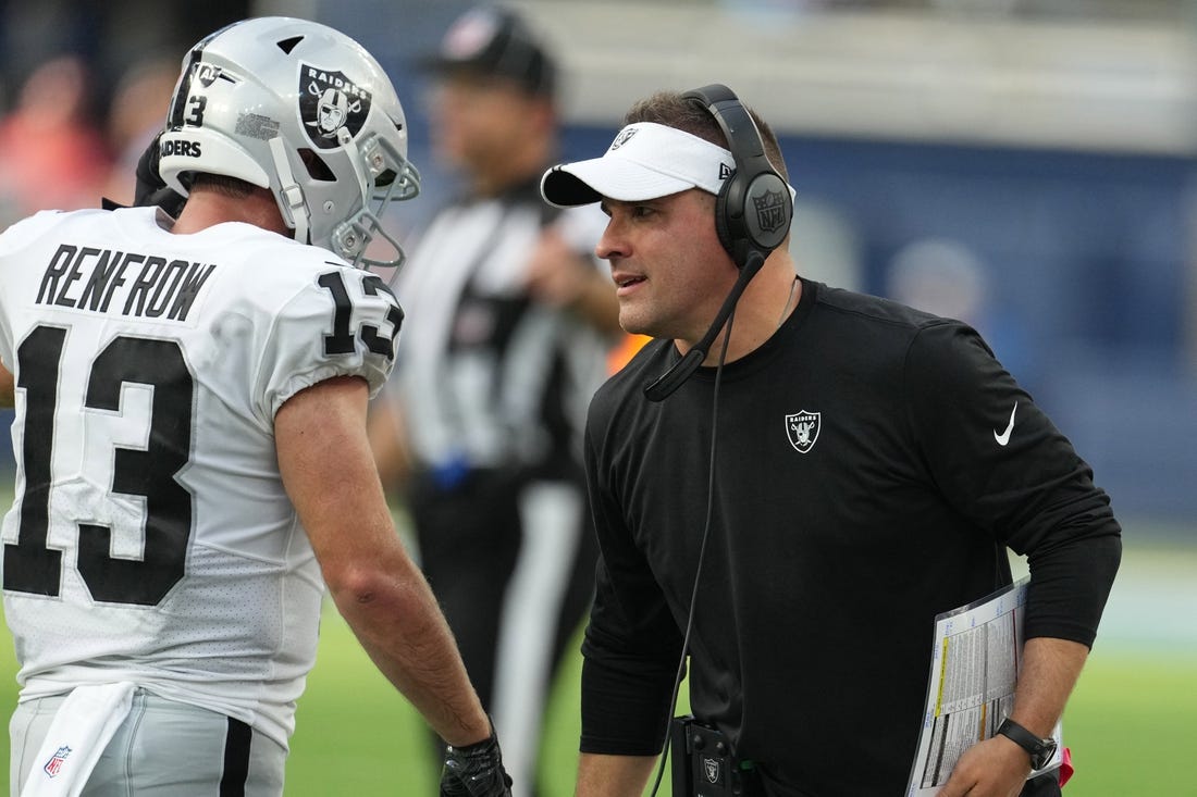 Sep 11, 2022; Inglewood, California, USA; Las Vegas Raiders coach Josh McDaniels (right) and wide receiver Hunter Renfrow (13) react in the second half against the Los Angeles Chargers at SoFi Stadium. Mandatory Credit: Kirby Lee-USA TODAY Sports