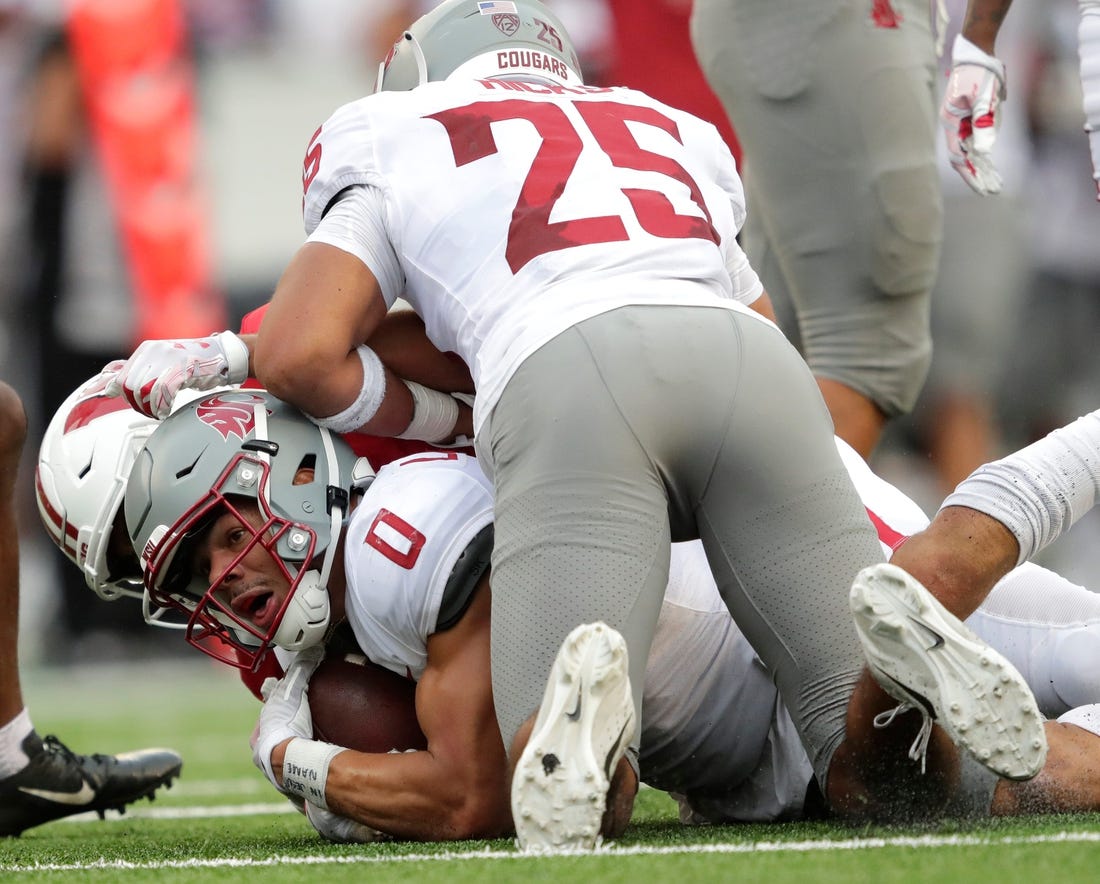 Washington State Cougars defensive back Sam Lockett III (0) recovers a fumble by Wisconsin Badgers tight end Clay Cundiff (not pictured) against Wisconsin Badgers wide receiver Chimere Dike (13) and Wisconsin Badgers linebacker Jake Ratzlaff (25) late in the fourth quarter during their football game Saturday, September 10, 2022, at Camp Randall in Madison, Wis.

Mjs Apc Badgersvswash 0910221722djp