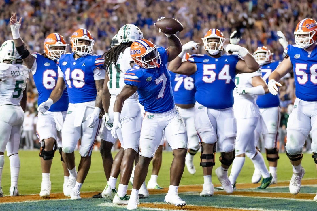 Florida Gators running back Trevor Etienne (7) rushes with the ball for a touchdown during the second half against the South Florida Bulls at Steve Spurrier Field at Ben Hill Griffin Stadium in Gainesville, FL on Saturday, September 17, 2022. [Matt Pendleton/Gainesville Sun]

Ncaa Football Florida Gators Vs South Florida Bulls