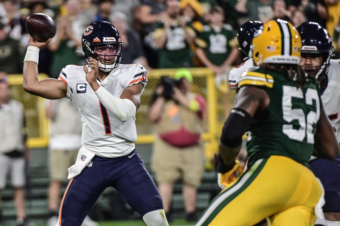Sep 18, 2022; Green Bay, Wisconsin, USA; Chicago Bears quarterback Justin Fields (1) looks to pass in the first quarter against the Green Bay Packers at Lambeau Field. Mandatory Credit: Benny Sieu-USA TODAY Sports