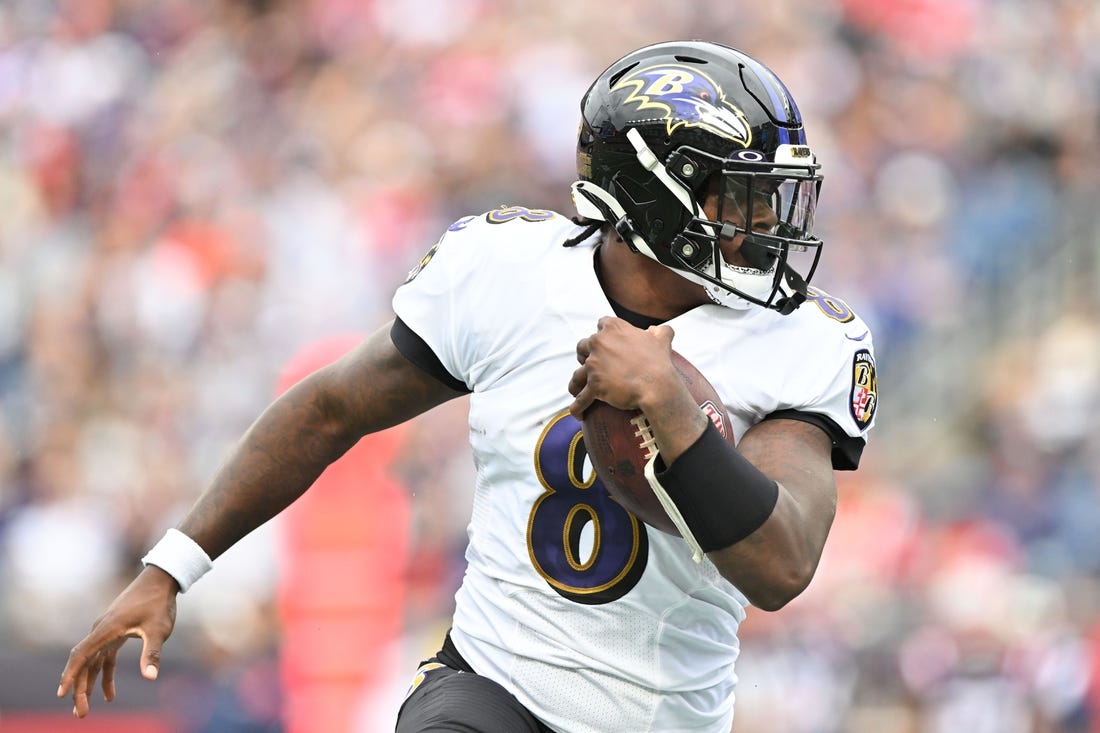 Sep 25, 2022; Foxborough, Massachusetts, USA; Baltimore Ravens quarterback Lamar Jackson (8) runs with ball during the second half of a game against the New England Patriots at Gillette Stadium. Mandatory Credit: Brian Fluharty-USA TODAY Sports