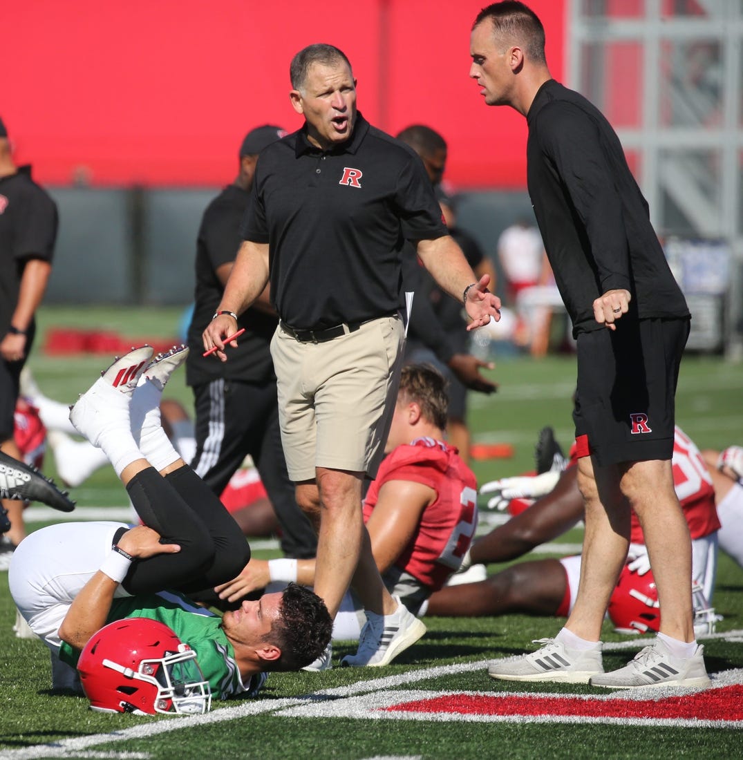 Quarterback, Noah Vedral, head coach Greg Schiano with offensive coordinator Sean Gleeson as Rutgers football players participate in their first day of training camp to start the 2022 season at their practice facility in Piscataway, NJ on August 3, 2022.

Rutgers Football Players Participate In Their First Day Of Training Camp To Start The 2022 Season At Their Practice Facility In Piscataway Nj On August 3 2022