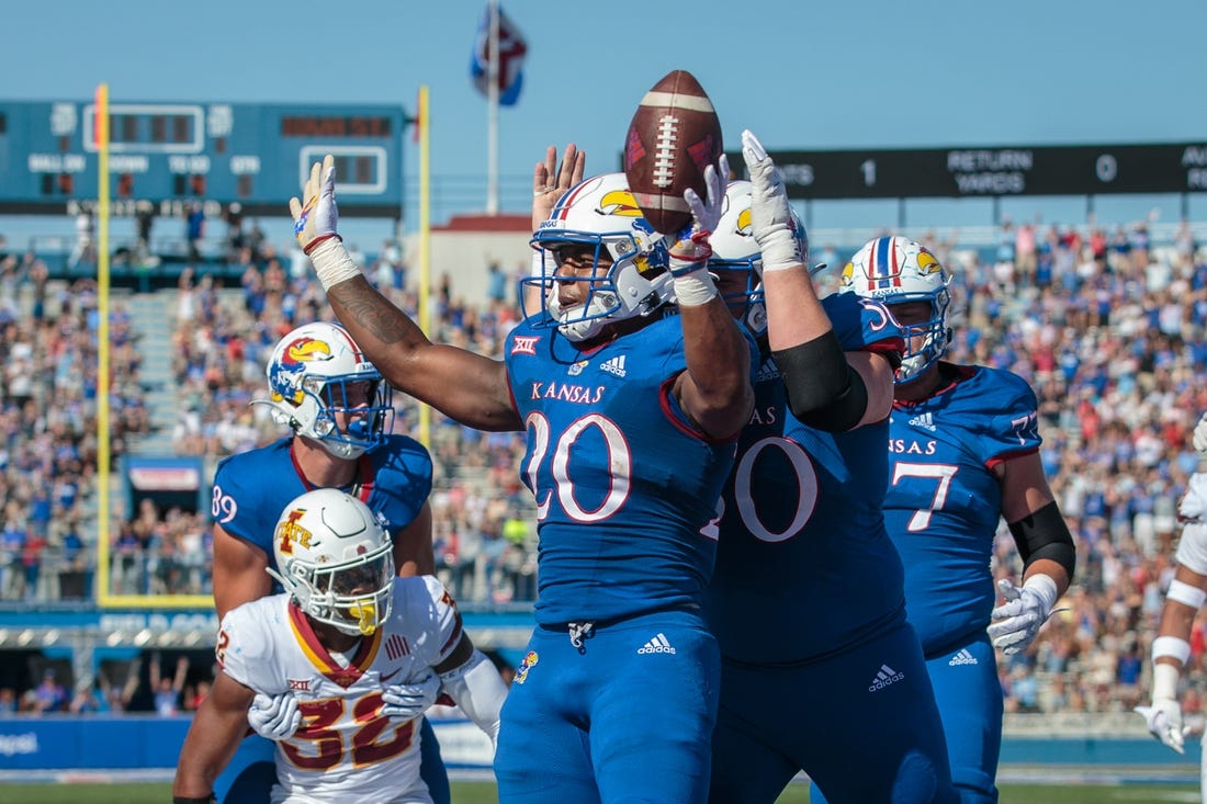 Oct 1, 2022; Lawrence, Kansas, USA; Kansas Jayhawks running back Daniel Hishaw Jr. (20) celebrates in the end zone after a touch down during the second quarter against the Iowa State Cyclones at David Booth Kansas Memorial Stadium. Mandatory Credit: William Purnell-USA TODAY Sports