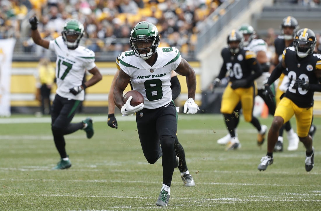 Oct 2, 2022; Pittsburgh, Pennsylvania, USA;  New York Jets wide receiver Elijah Moore (8) runs after a catch against the Pittsburgh Steelers during the first quarter at Acrisure Stadium. Mandatory Credit: Charles LeClaire-USA TODAY Sports