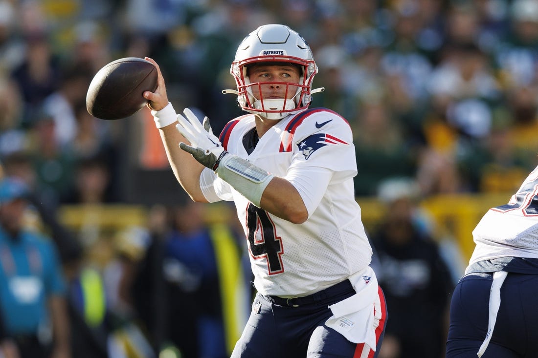 Oct 2, 2022; Green Bay, Wisconsin, USA;  New England Patriots quarterback Bailey Zappe (4) throws a pass during the second quarter against the Green Bay Packers at Lambeau Field. Mandatory Credit: Jeff Hanisch-USA TODAY Sports