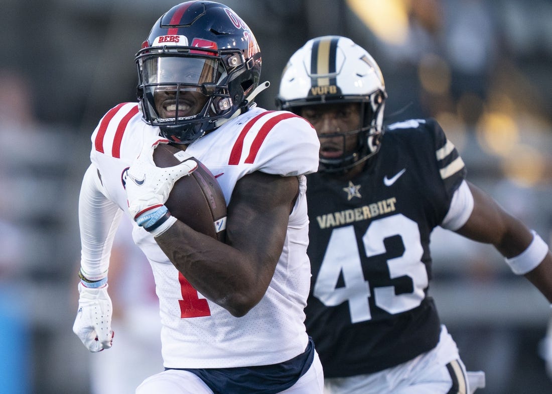Oct 8, 2022; Nashville, Tennessee, USA;  Mississippi Rebels wide receiver Jonathan Mingo (1) runs up the field with a 71 yard touchdown pass against Vanderbilt Commodores linebacker De'Rickey Wright (43) during the third quarter at FirstBank Stadium.  Mandatory Credit: George Walker IV - USA TODAY Sports