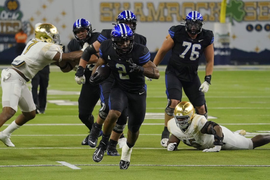 Oct 8, 2022; Paradise, Nevada, USA; Brigham Young Cougars running back Christopher Brooks (2) runs with the ball against the Notre Dame Fighting Irish during the second half at Allegiant Stadium. Mandatory Credit: Lucas Peltier-USA TODAY Sports