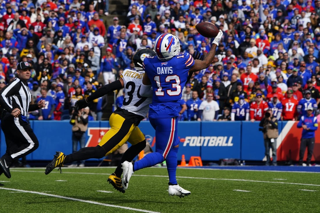 Oct 9, 2022; Orchard Park, New York, USA; Buffalo Bills wide receiver Gabriel Davis (13) catches the ball and scores a touchdown with Pittsburgh Steelers safety Minkah Fitzpatrick (39) defending during the first half at Highmark Stadium. Mandatory Credit: Gregory Fisher-USA TODAY Sports