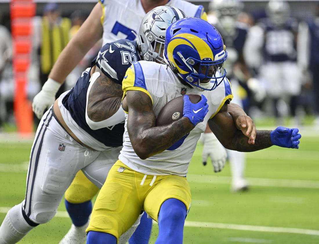 Oct 9, 2022; Inglewood, California, USA; Los Angeles Rams running back Cam Akers (3) is grabbed from behind by Dallas Cowboys defensive tackle Trysten Hill (72) during the  second quarter at SoFi Stadium. Mandatory Credit: Robert Hanashiro-USA TODAY Sports