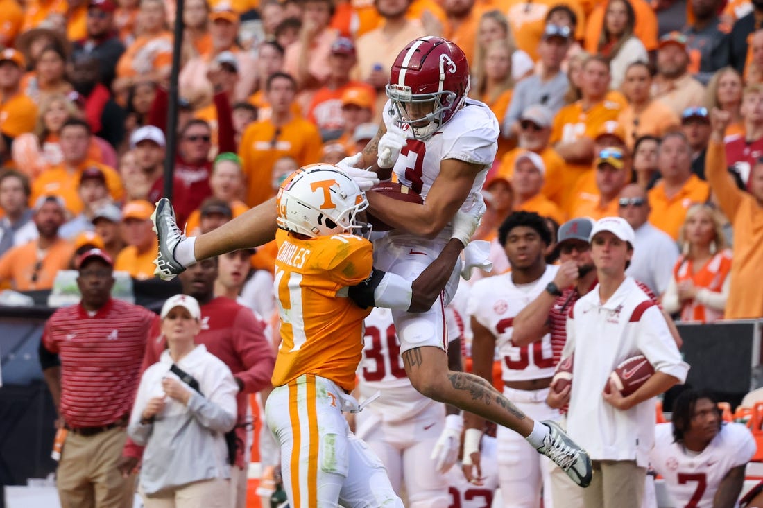 Oct 15, 2022; Knoxville, Tennessee, USA; Alabama Crimson Tide wide receiver Jermaine Burton (3) catches a pass against Tennessee Volunteers defensive back Christian Charles (14) during the second half at Neyland Stadium. Mandatory Credit: Randy Sartin-USA TODAY Sports