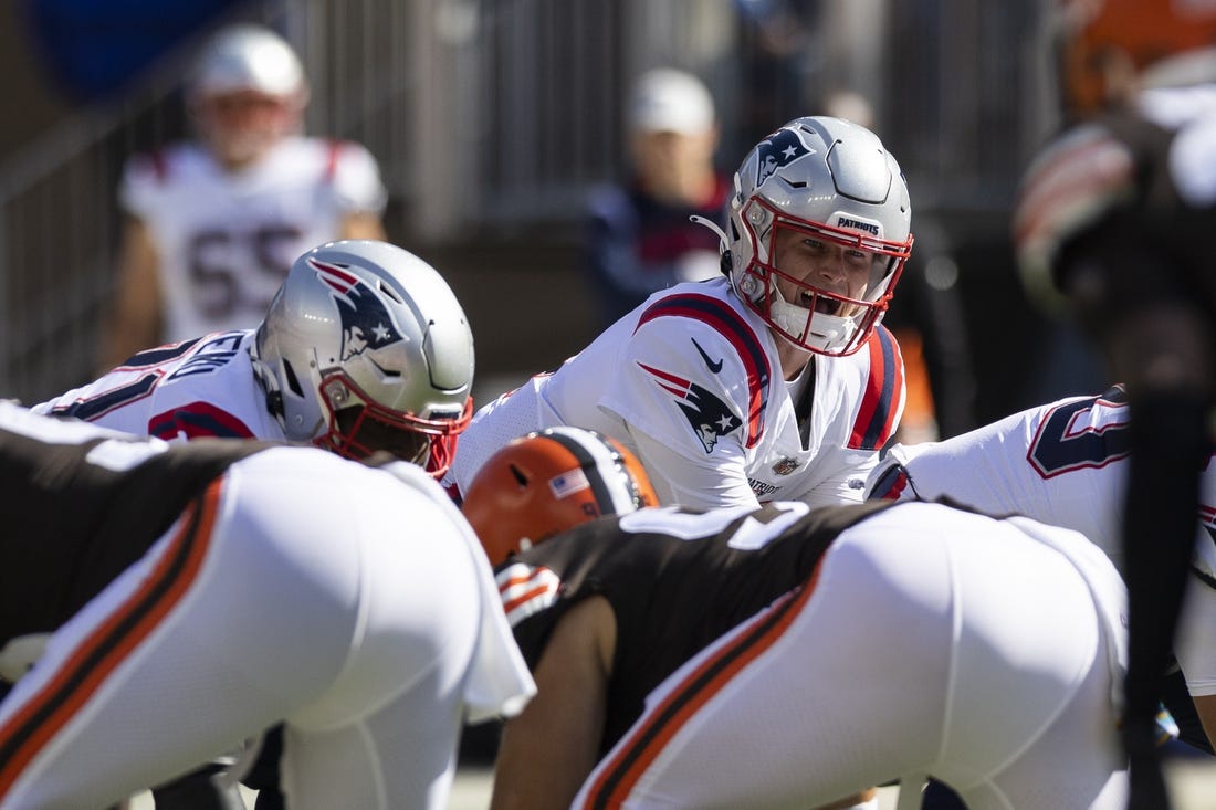Oct 16, 2022; Cleveland, Ohio, USA; New England Patriots quarterback Bailey Zappe (4) lines up for the snap against the Cleveland Browns during the first quarter at FirstEnergy Stadium. Mandatory Credit: Scott Galvin-USA TODAY Sports