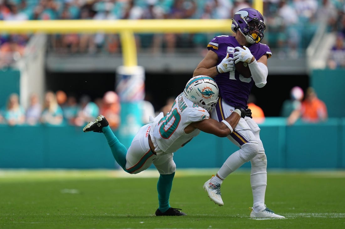 Miami Dolphins cornerback Nik Needham (40) makes a tackle on Minnesota Vikings wide receiver Adam Thielen (19) during the first half of an NFL game. Needham left the game after the play with a leg injury. Hard Rock Stadium, Miami Gardens, Oct. 16, 2022.

Vikings V Dolphins 26