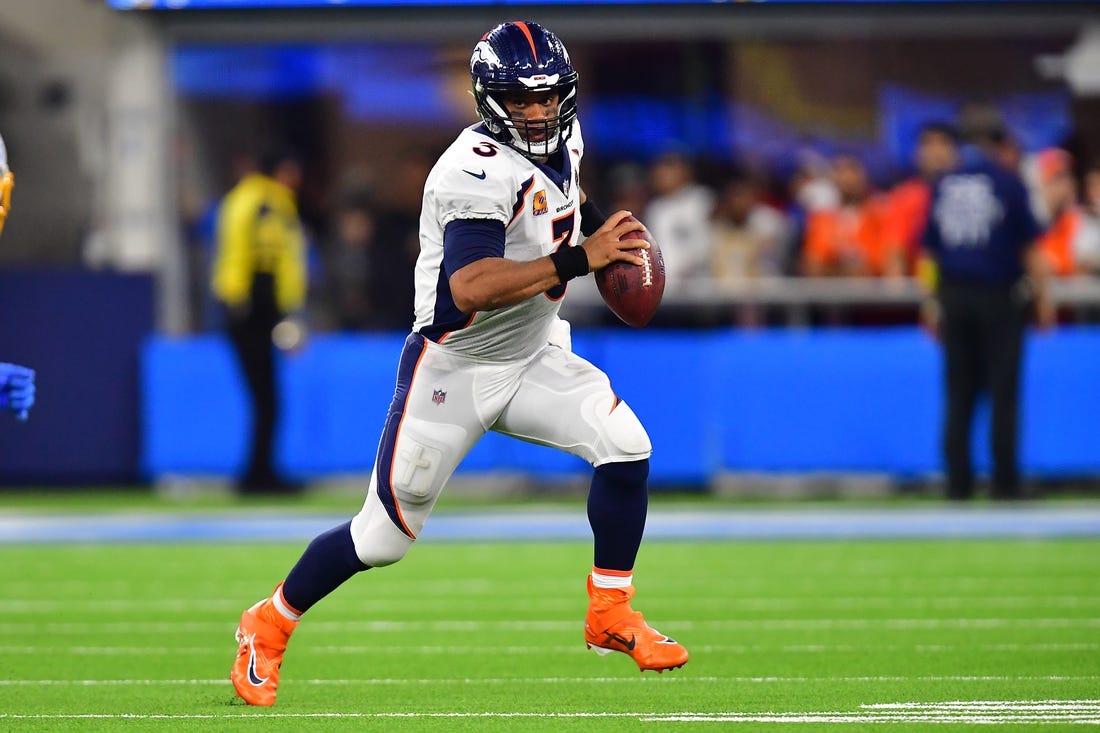 Oct 17, 2022; Inglewood, California, USA; Denver Broncos quarterback Russell Wilson (3) runs the ball against the Los Angeles Chargers during the second half at SoFi Stadium. Mandatory Credit: Gary A. Vasquez-USA TODAY Sports