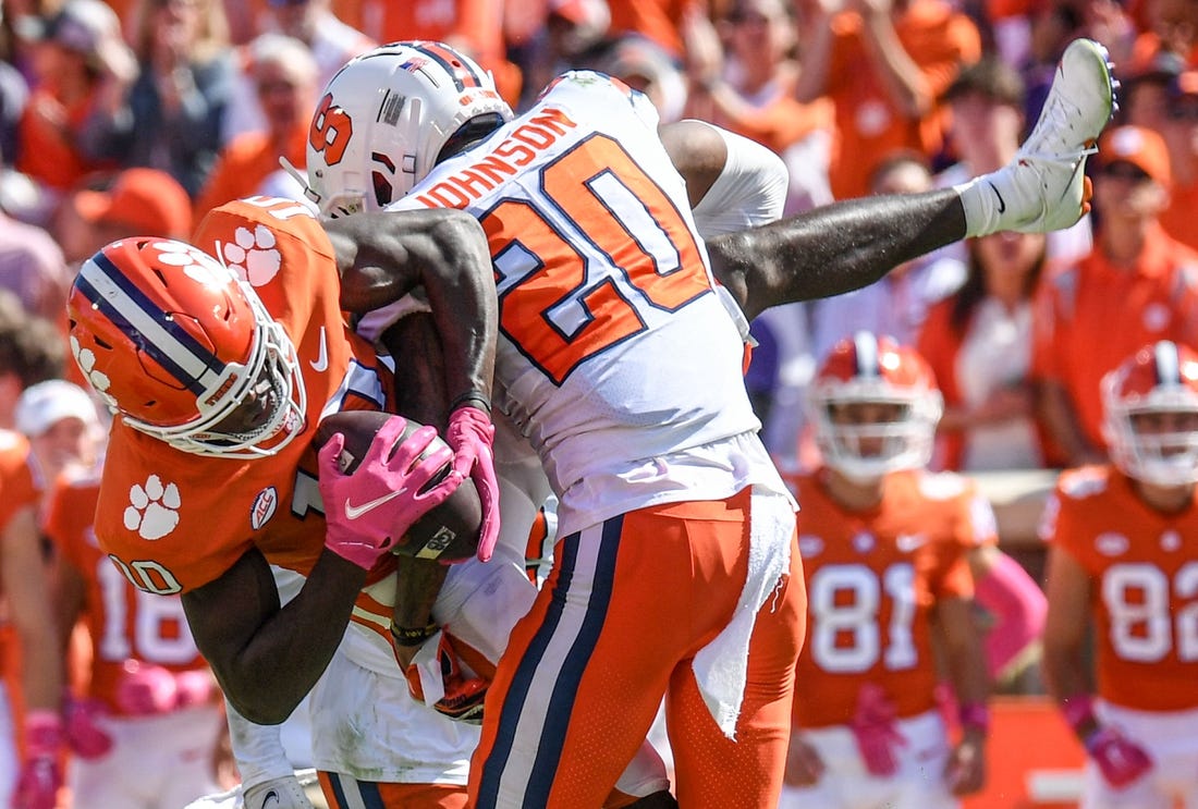 Oct 22, 2022; Clemson, SC, USA; Clemson wide receiver Joseph Ngata (10) gets tackled by Syracuse defensive back Isaiah Johnson (20) during the second quarter at Memorial Stadium in Clemson, South Carolina on Saturday, October 22, 2022.   Mandatory Credit: Ken Ruinard-USA TODAY NETWORK
