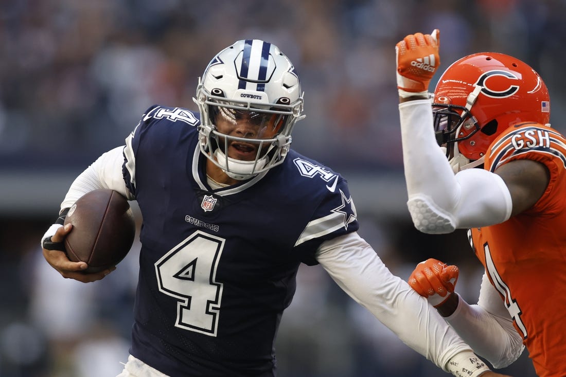 Oct 30, 2022; Arlington, Texas, USA; Chicago Bears safety Eddie Jackson (4) runs the ball for a first down in the second quarter against the Chicago Bears at AT&T Stadium. Mandatory Credit: Tim Heitman-USA TODAY Sports