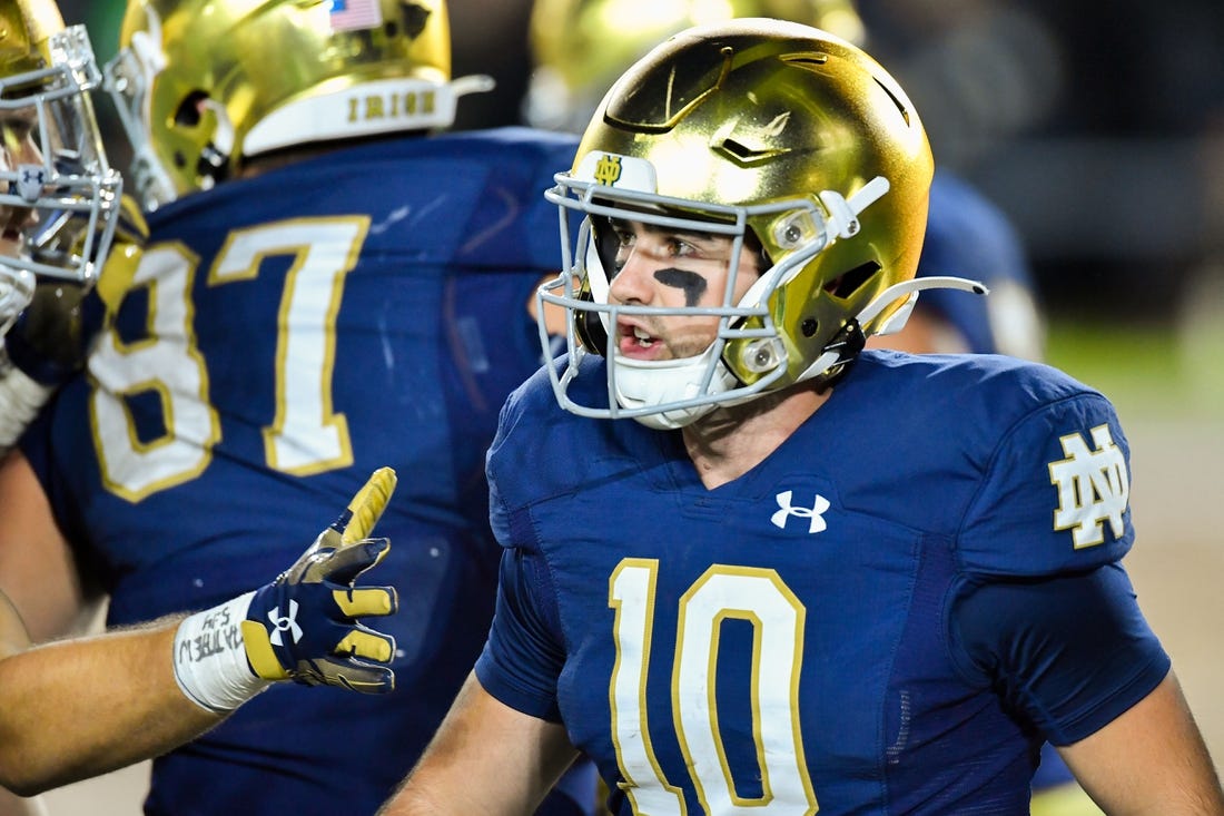 Oct 15, 2022; South Bend, Indiana, USA; Notre Dame Fighting Irish quarterback Drew Pyne (10) reacts after a touchdown in the third quarter against the Stanford Cardinal at Notre Dame Stadium. Mandatory Credit: Matt Cashore-USA TODAY Sports