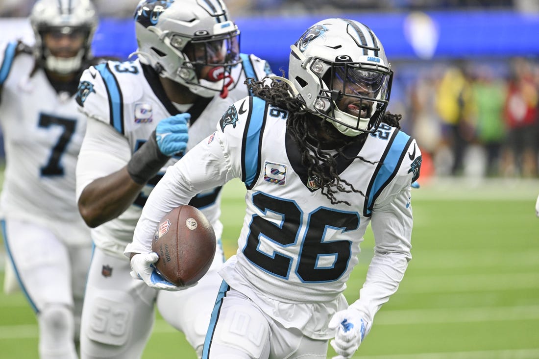 Oct 16, 2022; Inglewood, California, USA; Carolina Panthers cornerback Donte Jackson (26) returns an interception for 30 yards and a touchdown in the second quarter against the Los Angeles Rams at SoFi Stadium. Mandatory Credit: Robert Hanashiro-USA TODAY Sports