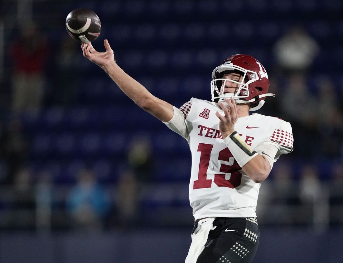 Oct 29, 2022; Annapolis, Maryland, USA; Temple Owls quarterback E.J. Warner (13) throws an interception in overtime against the Navy Midshipmen at Navy-Marine Corps Memorial Stadium. Mandatory Credit: Brent Skeen-USA TODAY Sports