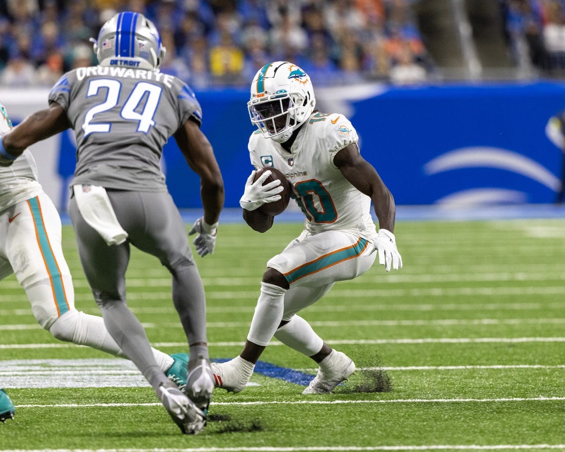 Oct 30, 2022; Detroit, Michigan, USA; Miami Dolphins wide receiver Tyreek Hill (10) runs with the ball against the Detroit Lions during the second half at Ford Field. Mandatory Credit: David Reginek-USA TODAY Sports