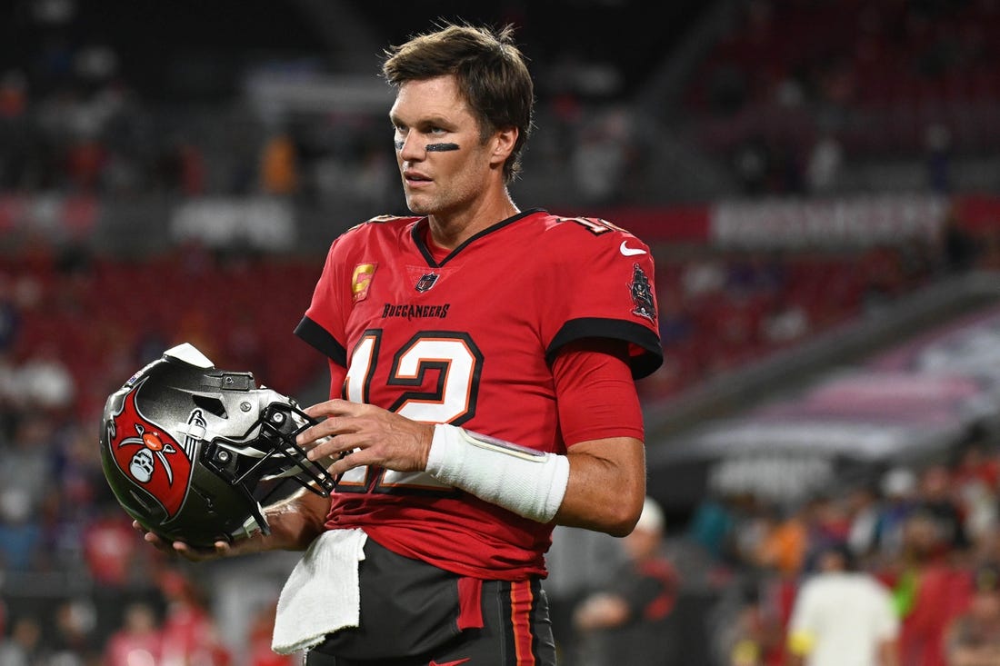 Oct 27, 2022; Tampa, Florida, USA; Tampa Bay Buccaneers quarterback Tom Brady (12) warms up before the start of the game against the Baltimore Ravens at Raymond James Stadium. Mandatory Credit: Jonathan Dyer-USA TODAY Sports