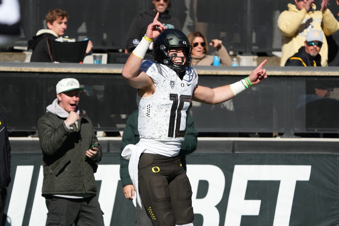 Nov 5, 2022; Boulder, Colorado, USA; Oregon Ducks quarterback Bo Nix (10) celebrates his touchdown reception in in the first quarter against the Colorado Buffaloes at Folsom Field. Mandatory Credit: Ron Chenoy-USA TODAY Sports