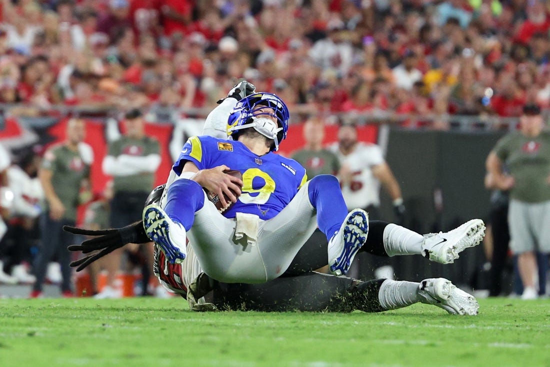 Nov 6, 2022; Tampa, Florida, USA;  Los Angeles Rams quarterback Matthew Stafford (9) is sacked by Tampa Bay Buccaneers defensive tackle Rakeem Nunez-Roches (56) in the third quarter at Raymond James Stadium. Mandatory Credit: Nathan Ray Seebeck-USA TODAY Sports