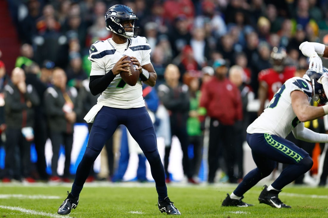 Nov 13, 2022; Munich, Germany, DEU; Seattle Seahawks quarterback Geno Smith (7) looks to pass against the Tampa Bay Buccaneers during the second quarter of an International Series game at Allianz Arena. Mandatory Credit: Douglas DeFelice-USA TODAY Sports