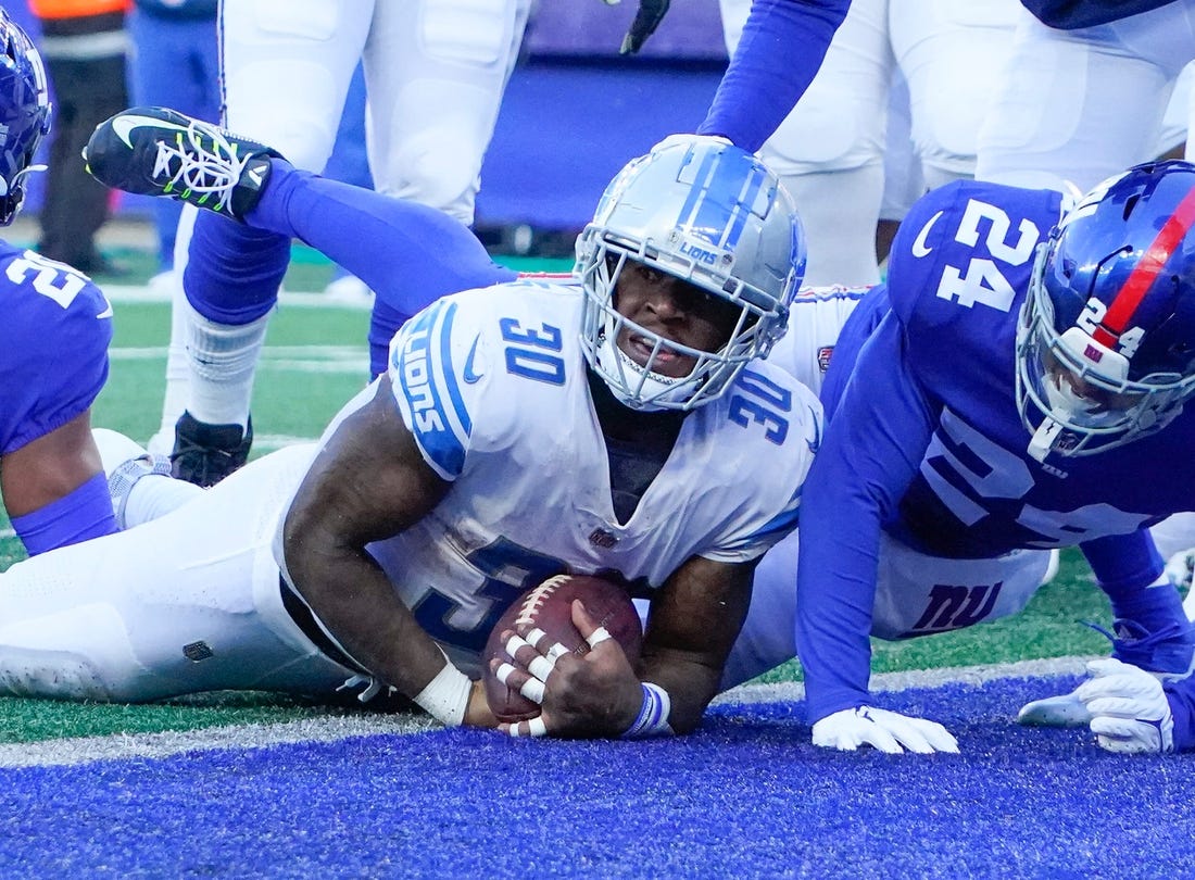 Nov 20, 2022; East Rutherford, NJ, USA;  Detroit Lions running back Jamaal Williams (30) scores touchdown in the first half against the New York Giants at MetLife Stadium. Mandatory Credit: Robert Deutsch-USA TODAY Sports