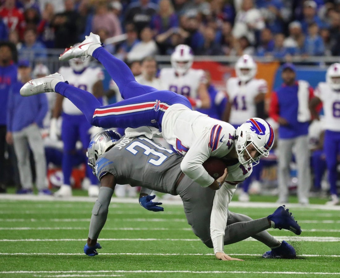 Detroit Lions safety Kerby Joseph (31) tackles Buffalo Bills quarterback Josh Allen (17) during first-half action at Ford Field on Thursday, Nov. 24, 2022.

Lions 112422 Kd 3281