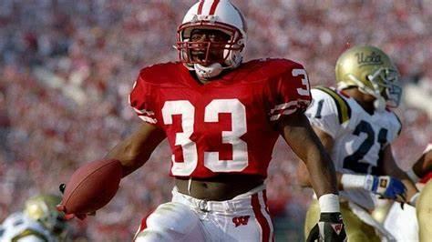 Brent Moss (file photo) pictured in the 1994 Rose Bowl. The Wisconsin running back was MVP of the victory over UCLA.