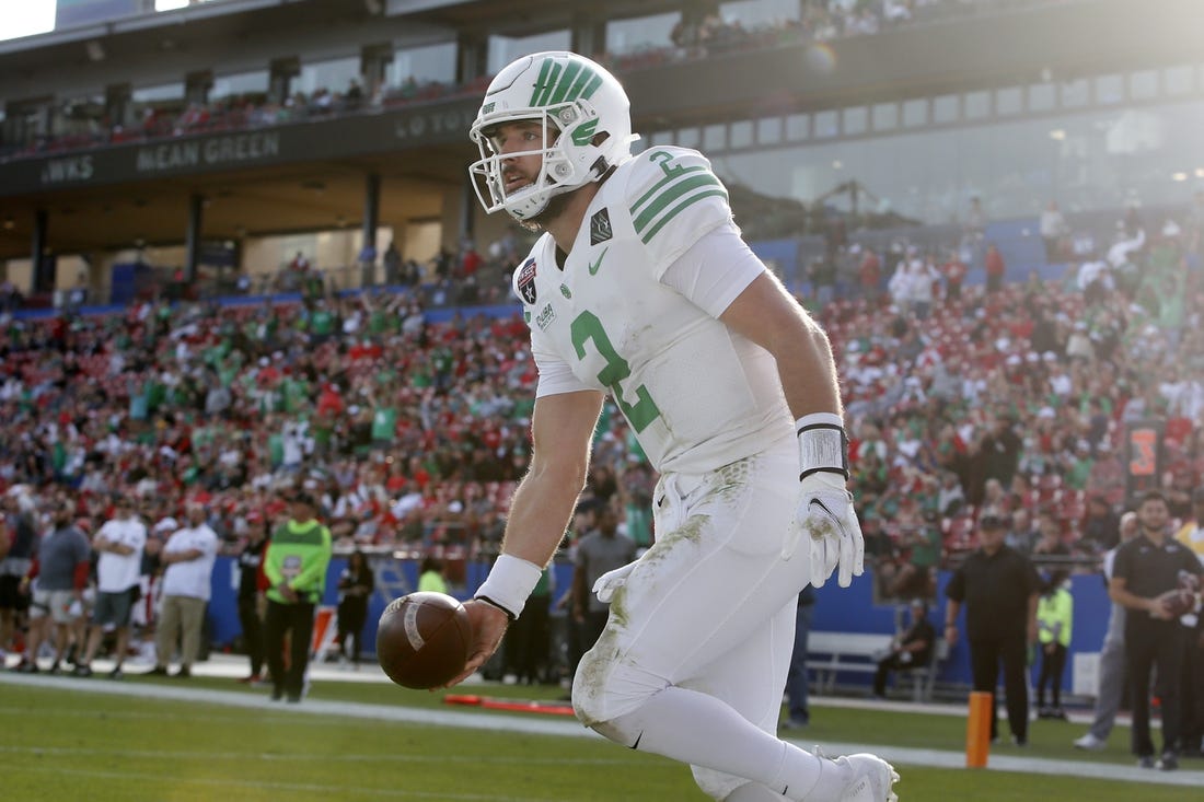 Dec 23, 2021; Frisco, TX, USA; North Texas Mean Green quarterback Austin Aune (2) celebrates a touchdown in the second quarter against the Miami (Oh) Redhawks at Toyota Stadium. Mandatory Credit: Tim Heitman-USA TODAY Sports