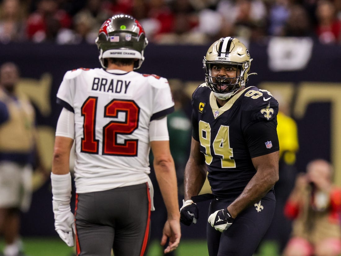 Sep 18, 2022; New Orleans, Louisiana, USA;  New Orleans Saints defensive end Cameron Jordan (94) stares at Tampa Bay Buccaneers quarterback Tom Brady (12) and reacts to a play during the second half at Caesars Superdome. Mandatory Credit: Stephen Lew-USA TODAY Sports