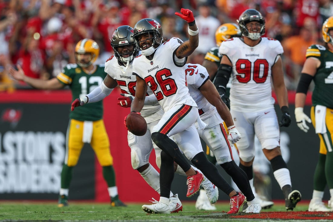 Sep 25, 2022; Tampa, Florida, USA;  Tampa Bay Buccaneers safety Logan Ryan (26) reacts after intercepting the ball against the Green Bay Packers in the third quarter at Raymond James Stadium. Mandatory Credit: Nathan Ray Seebeck-USA TODAY Sports