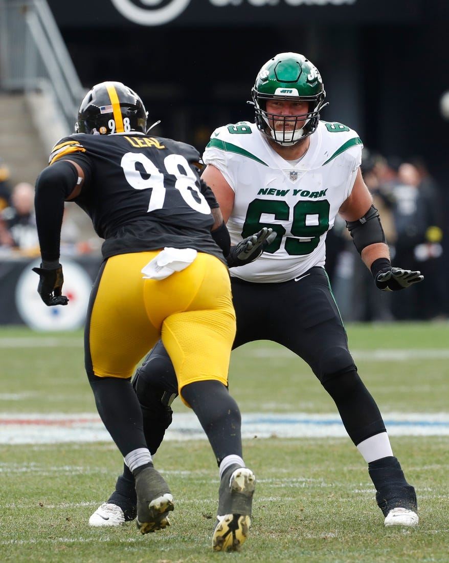 Oct 2, 2022; Pittsburgh, Pennsylvania, USA;  New York Jets offensive tackle Conor McDermott (69) blocks at he line of scrimmage against Pittsburgh Steelers defensive end DeMarvin Leal (98) during the second quarter at Acrisure Stadium. Mandatory Credit: Charles LeClaire-USA TODAY Sports