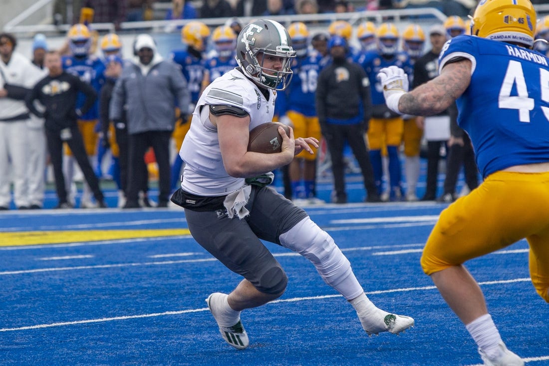Dec 20, 2022; Boise, Idaho, USA; Eastern Michigan Eagles quarterback Taylor Powell (7) runs for a first down during the first half of action of the Famous Idaho Potato Bowl against the San Jose State Spartans at Albertsons Stadium. Mandatory Credit: Brian Losness-USA TODAY Sports