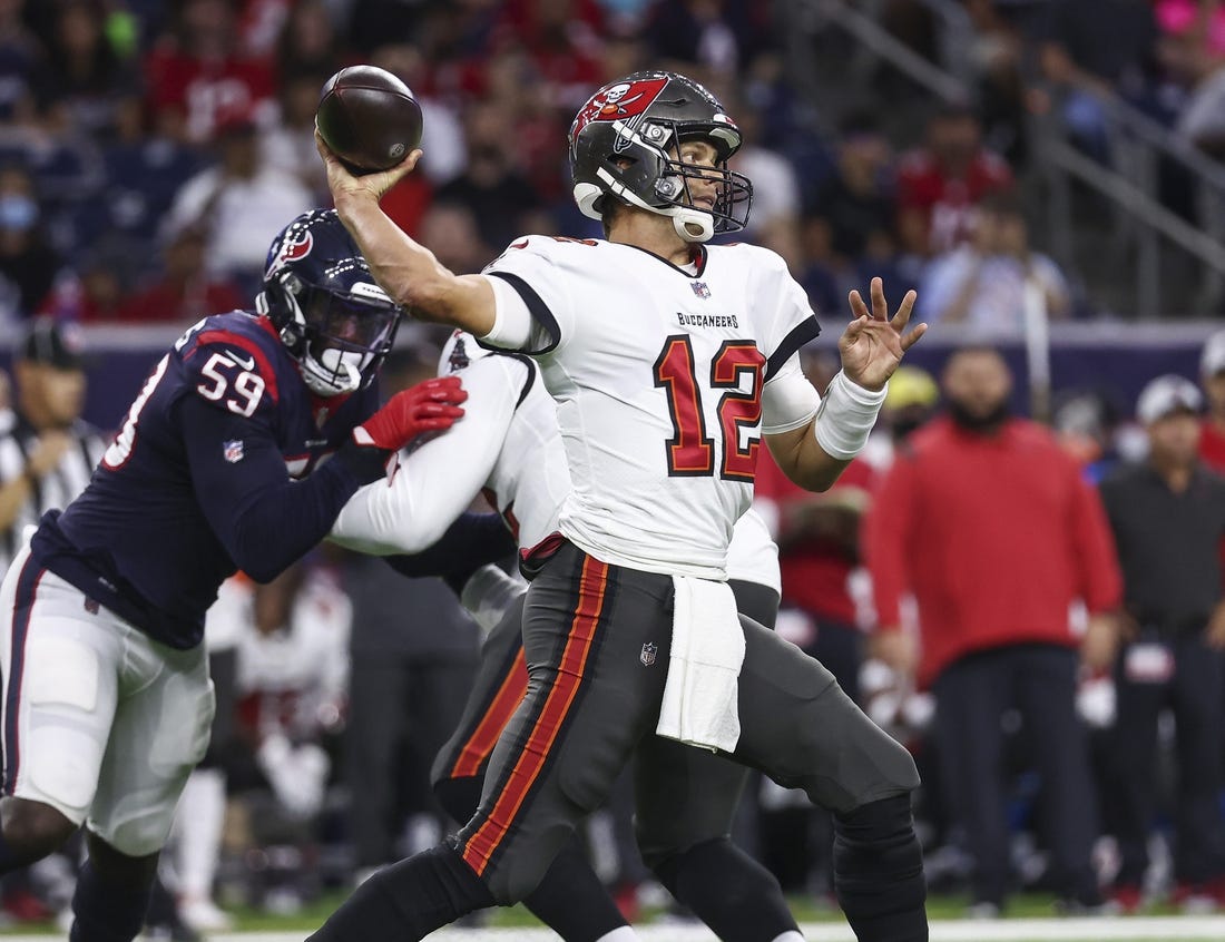 Aug 28, 2021; Houston, Texas, USA; Tampa Bay Buccaneers quarterback Tom Brady (12) attempts a pass during the first quarter against the Houston Texans at NRG Stadium. Mandatory Credit: Troy Taormina-USA TODAY Sports