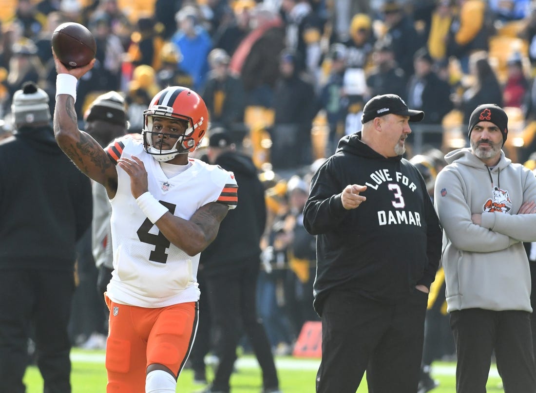 Jan 8, 2023; Pittsburgh, Pennsylvania, USA;  Cleveland Browns quarterback Deshaun Watson (4) throws a practice pass as head coach Kevin Stefanski (right) watches before playing the Pittsburgh Steelers at Acrisure Stadium. Mandatory Credit: Philip G. Pavely-USA TODAY Sports