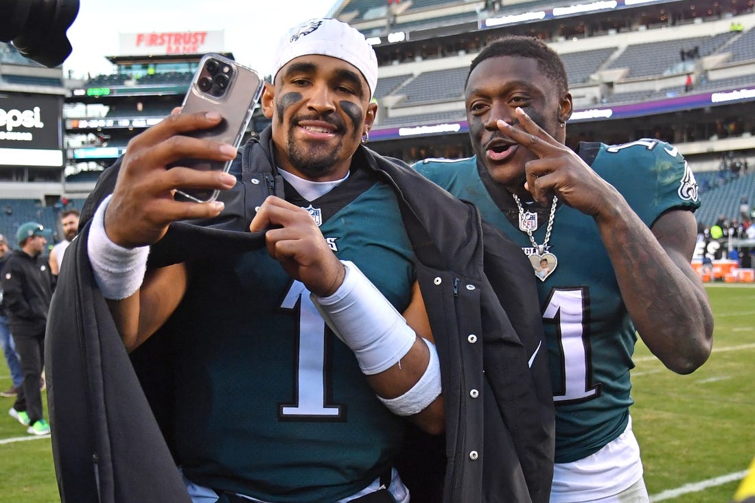 Dec 4, 2022; Philadelphia, Pennsylvania, USA; Philadelphia Eagles quarterback Jalen Hurts (1) and wide receiver A.J. Brown (11) walks off the field after win against the Tennessee Titans at Lincoln Financial Field. Mandatory Credit: Eric Hartline-USA TODAY Sports