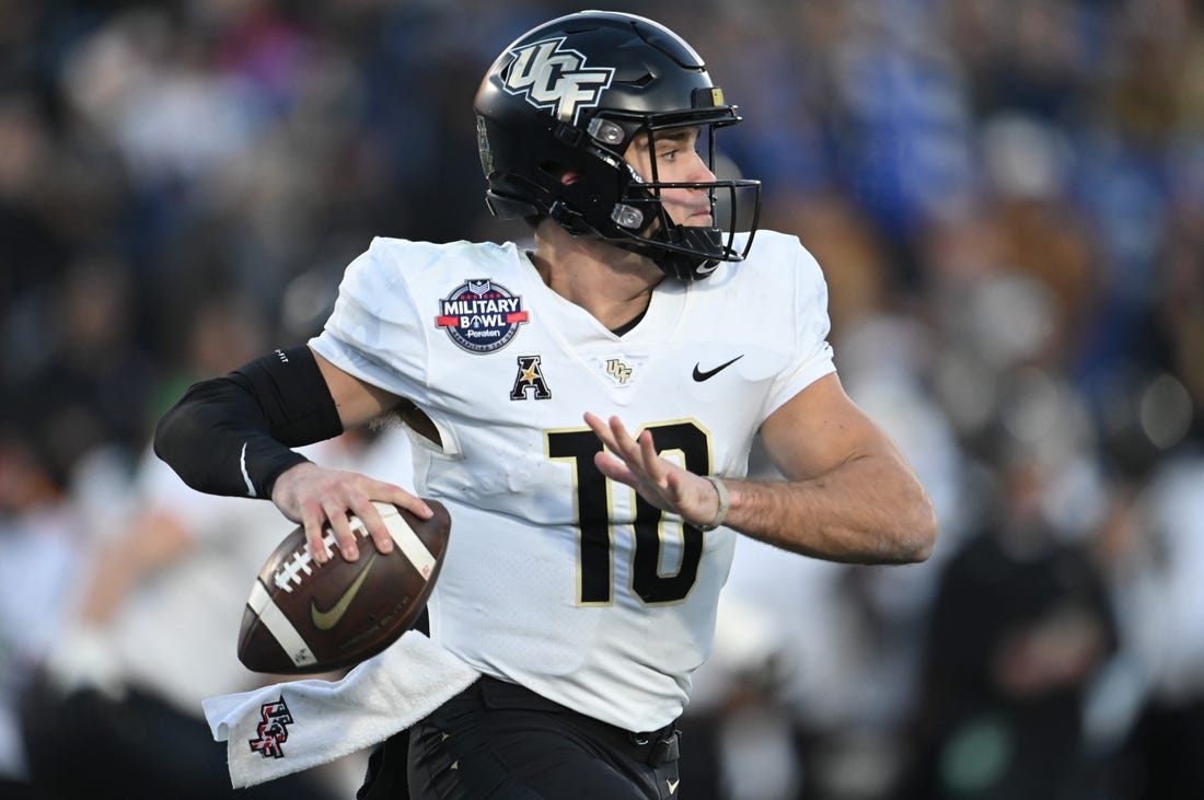 Dec 28, 2022; Annapolis, Maryland, USA; UCF quarterback John Rhys Plumlee (10) throws own the run against Duke in the 2022 Military Bowl at Navy-Marine Corps Memorial Stadium. Mandatory Credit: Tommy Gilligan-USA TODAY Sports