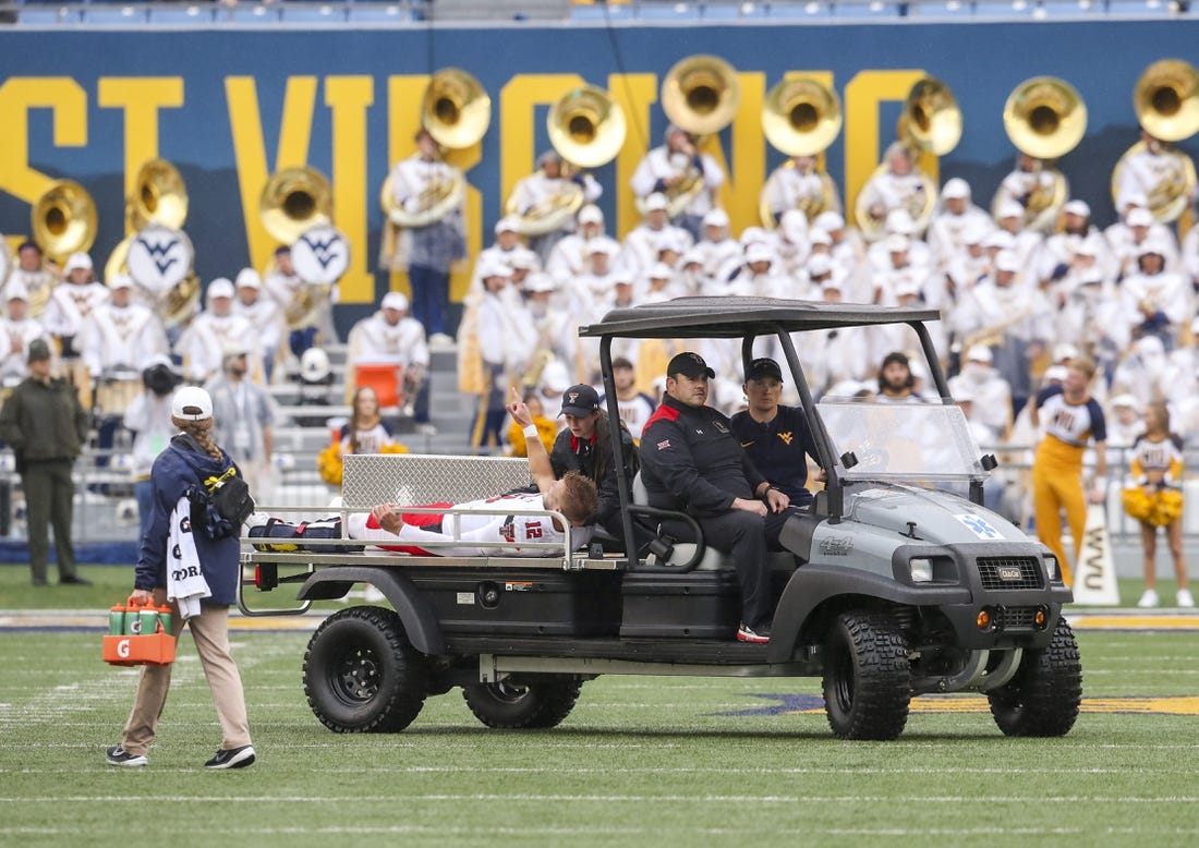 Sep 23, 2023; Morgantown, West Virginia, USA; Texas Tech Red Raiders quarterback Tyler Shough (12) gestures as he is carted off the field after an injury during the first quarter against the West Virginia Mountaineers at Mountaineer Field at Milan Puskar Stadium. Mandatory Credit: Ben Queen-USA TODAY Sports