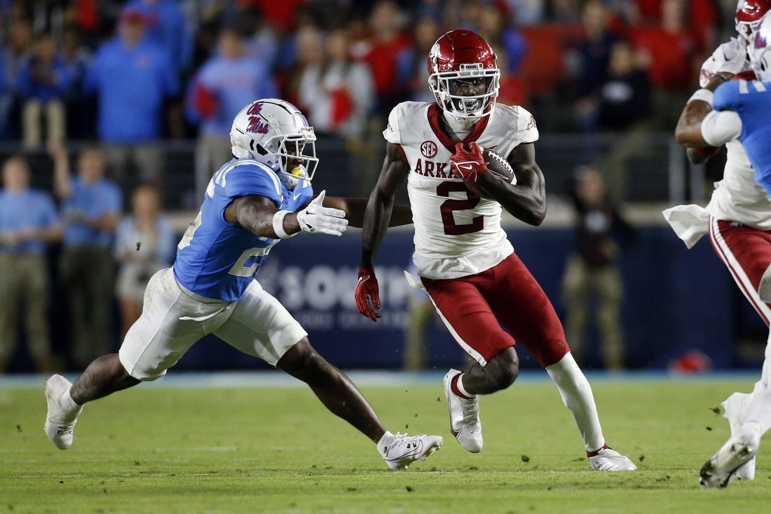 Oct 7, 2023; Oxford, Mississippi, USA; Arkansas Razorbacks wide receiver Andrew Armstrong (2) runs after a catch as Mississippi Rebels defensive back Trey Washington (25) makes the tackle during the first half at Vaught-Hemingway Stadium. Mandatory Credit: Petre Thomas-USA TODAY Sports