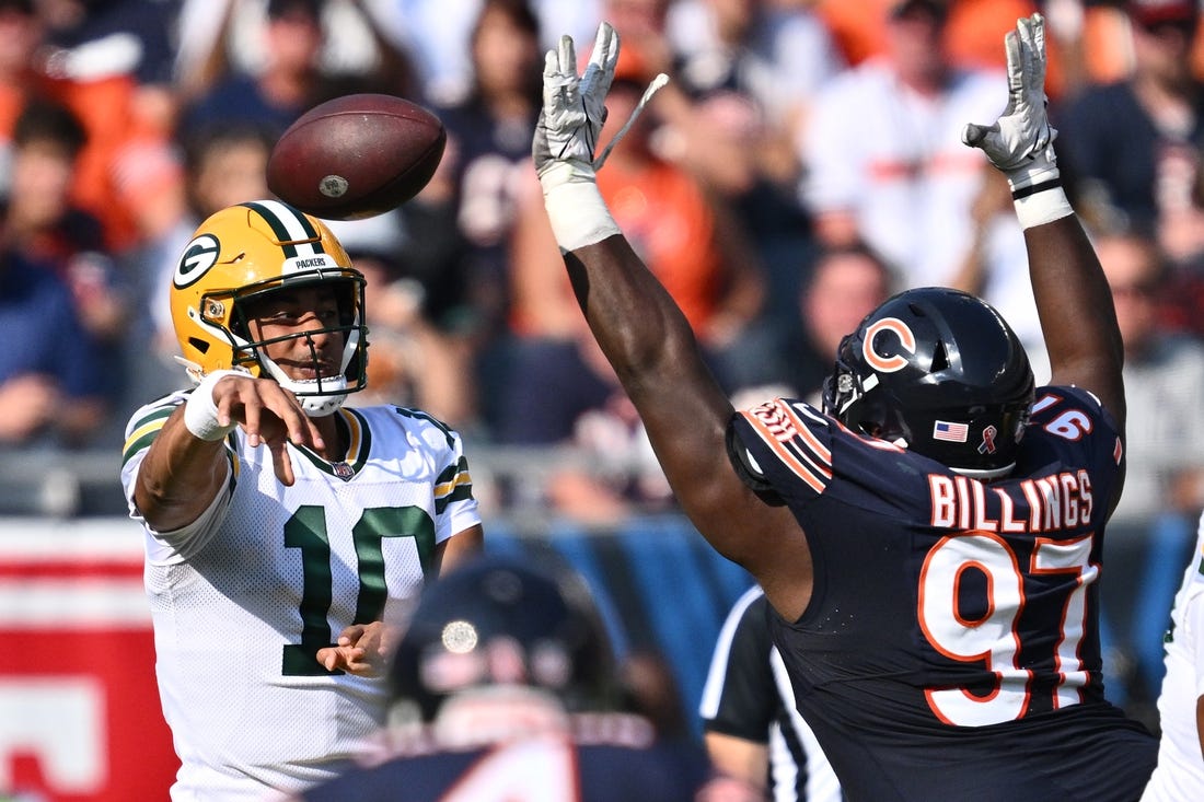 Sep 10, 2023; Chicago, Illinois, USA;  Green Bay Packers quarterback Jordan Love (10) passes over the defense of Chicago Bears defensive lineman Andrew Billings (97) in the first half at Soldier Field. Mandatory Credit: Jamie Sabau-USA TODAY Sports