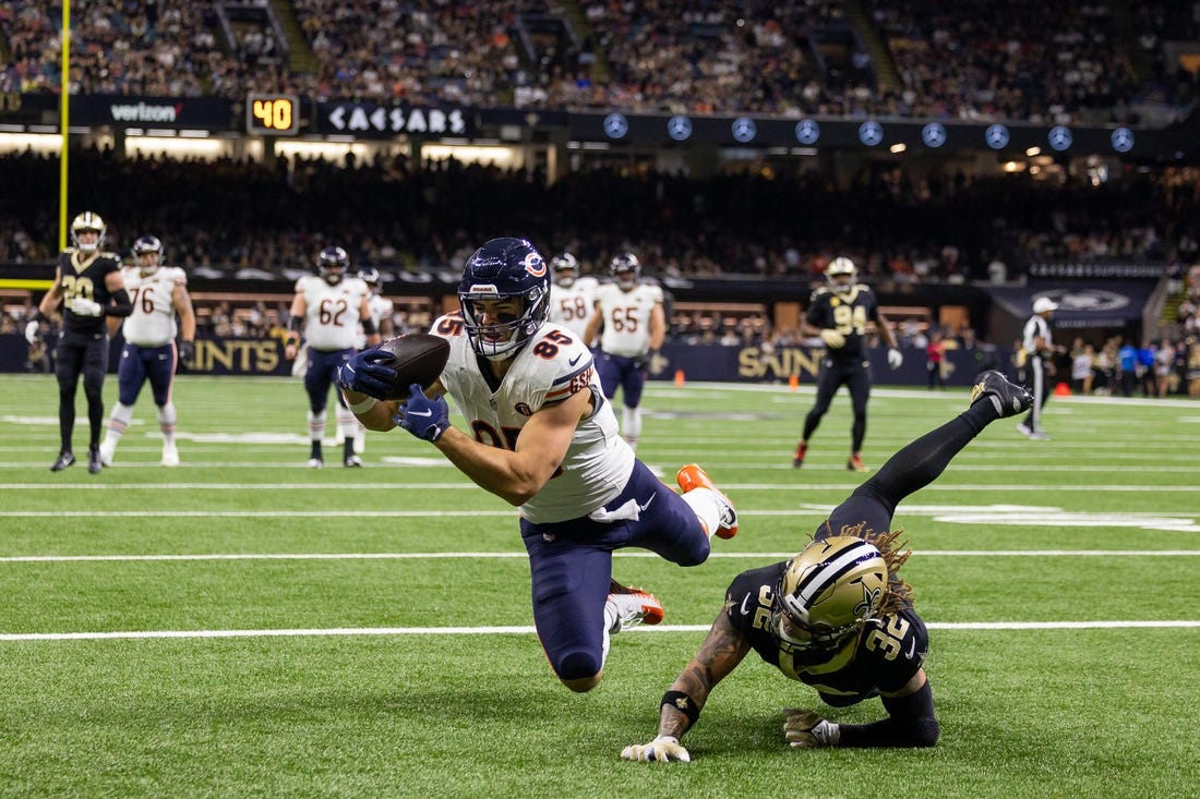 Nov 5, 2023; New Orleans, Louisiana, USA;  Chicago Bears tight end Cole Kmet (85) catches a touchdown pass over New Orleans Saints safety Tyrann Mathieu (32) during the first half at the Caesars Superdome. Mandatory Credit: Stephen Lew-USA TODAY Sports
