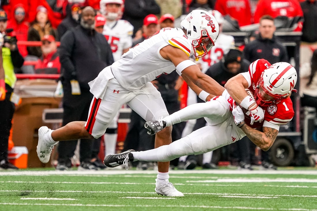 Nov 11, 2023; Lincoln, Nebraska, USA; Nebraska Cornhuskers wide receiver Billy Kemp IV (1) is brought down by Maryland Terrapins defensive back Beau Brade (2) during the second quarter at Memorial Stadium. Mandatory Credit: Dylan Widger-USA TODAY Sports