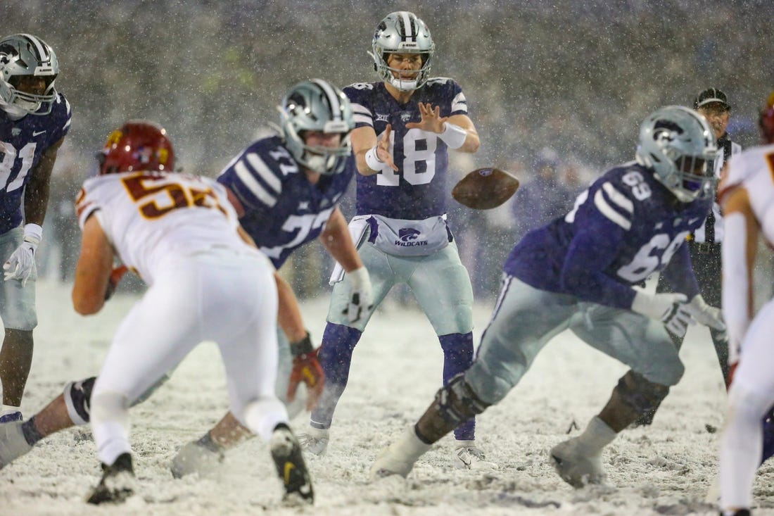 Nov 25, 2023; Manhattan, Kansas, USA; Kansas State Wildcats quarterback Will Howard (18) takes the snap during the second quarter against the Iowa State Cyclones at Bill Snyder Family Football Stadium. Mandatory Credit: Scott Sewell-USA TODAY Sports