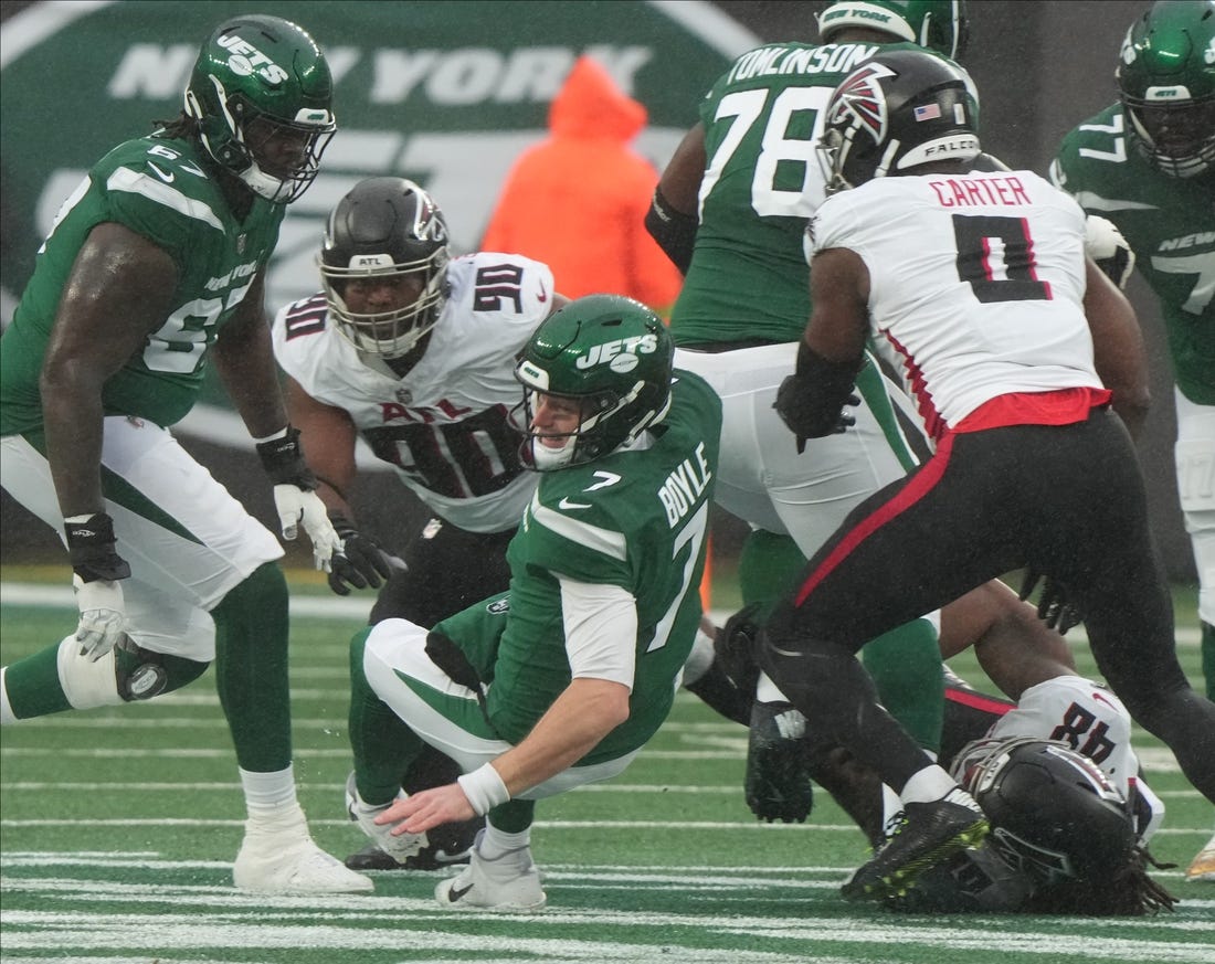East Rutherford, NJ     December 3, 2023 -- Jets quarterback Tim Boyle is sacked in the first half. The Atlanta Falcons topped the NY Jets 13-8 at MetLife Stadium on December 3, 2023 in East Rutherford, NJ.