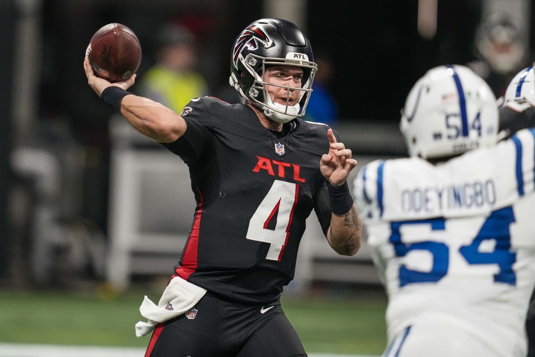 Dec 24, 2023; Atlanta, Georgia, USA; Atlanta Falcons quarterback Taylor Heinicke (4) passes the ball against the Indianapolis Colts during the first half at Mercedes-Benz Stadium. Mandatory Credit: Dale Zanine-USA TODAY Sports