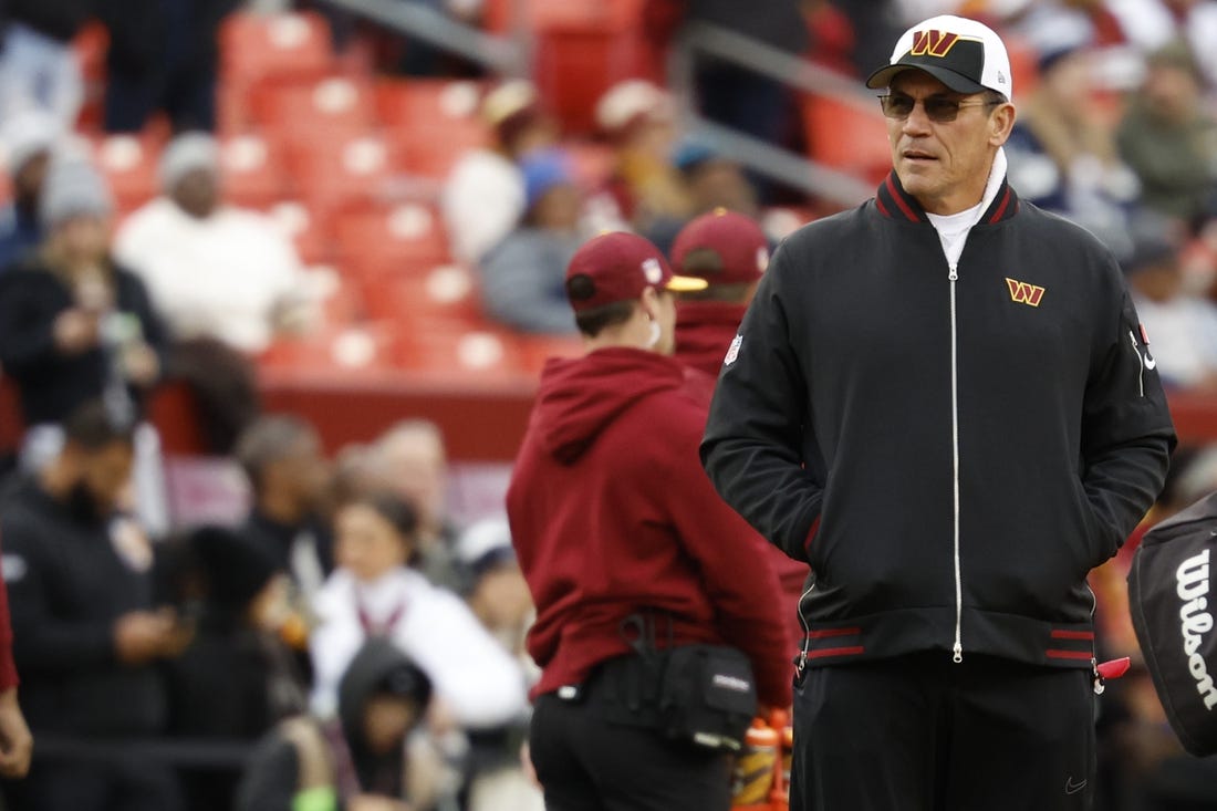 Jan 7, 2024; Landover, Maryland, USA; Washington Commanders head coach Ron Rivera stands on the field during warmups prior to the game against the Dallas Cowboys at FedExField. Mandatory Credit: Geoff Burke-USA TODAY Sports